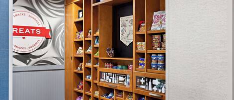 A snack and sundries section with a 'Welcome to Canton' sign above.