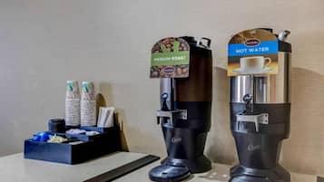A coffee machine with a medium roast label and a hot water dispenser.