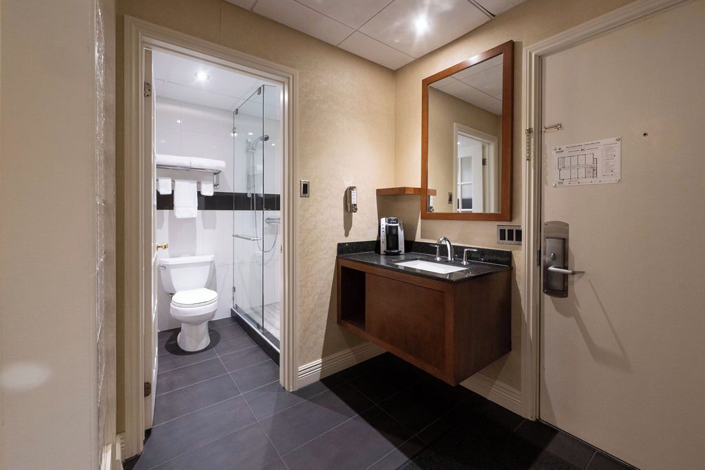 signature room | bathroom | shower, eco-friendly toiletries, hair dryer, bathrobes