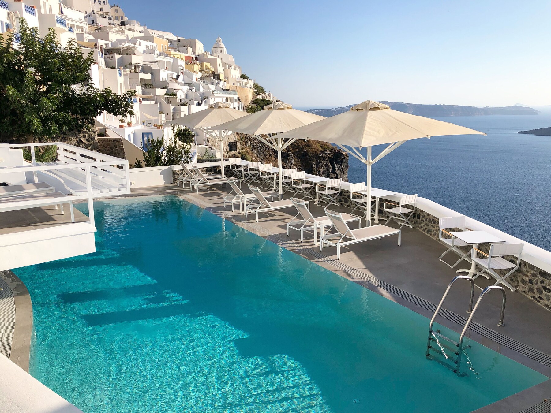 Seasonal outdoor pool, pool umbrellas, pool loungers