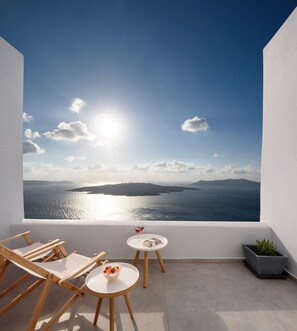 Suite, Balcony (Caldera View) | Premium bedding, minibar, in-room safe, individually decorated