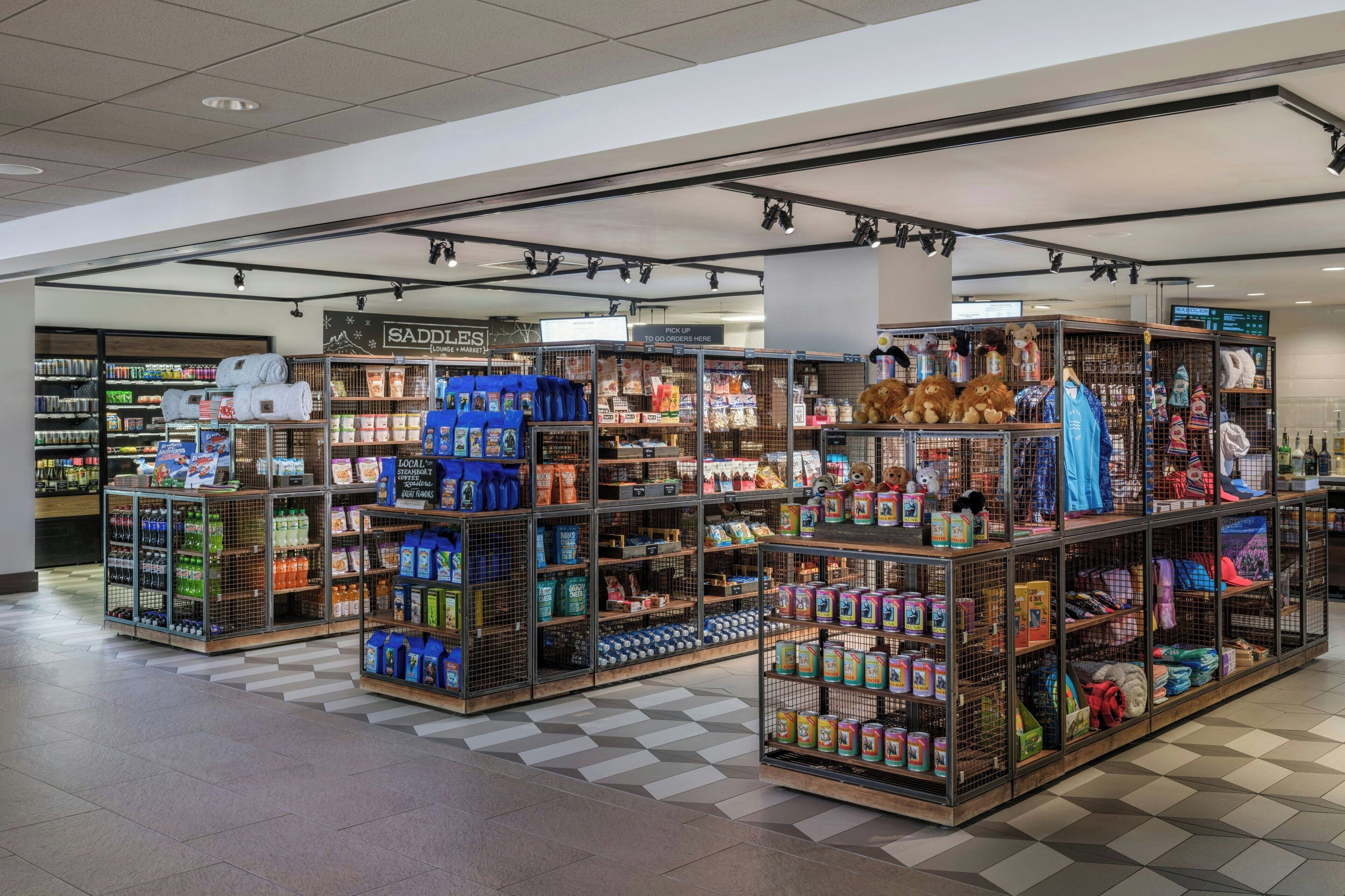 A store with various aisles of products, including snacks and beverages.