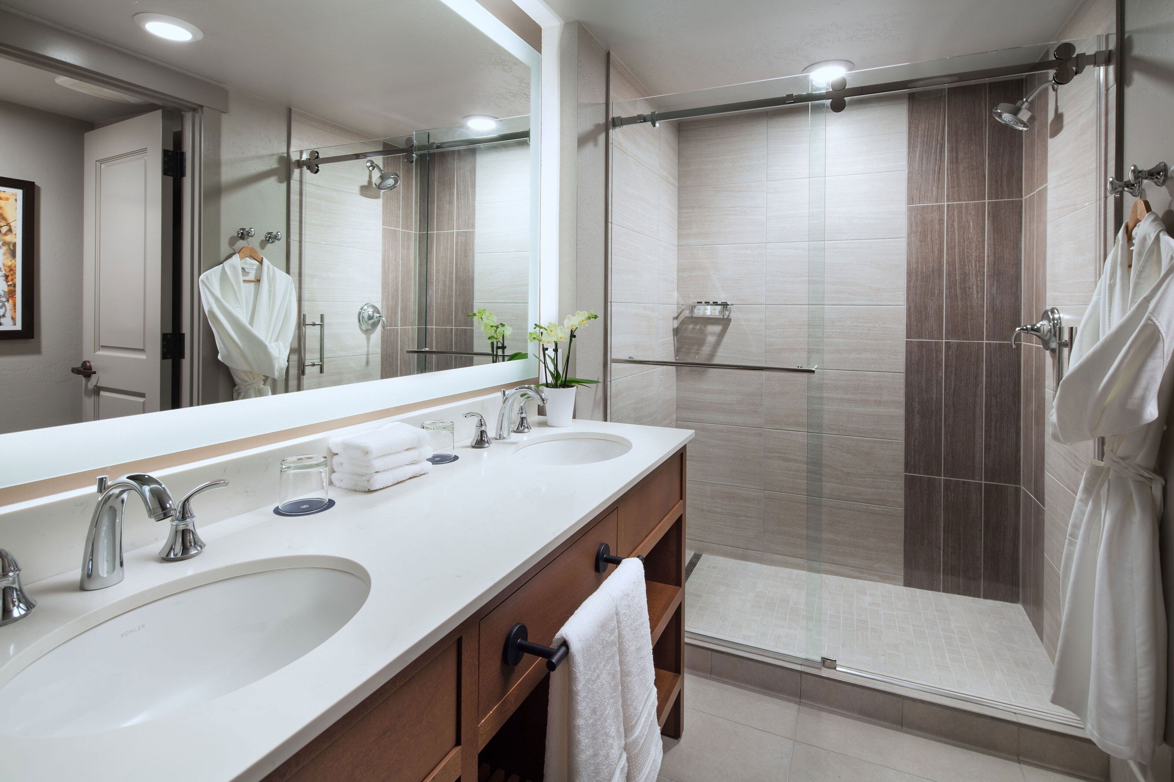 designer toiletries, hair dryer, bathrobes, towels