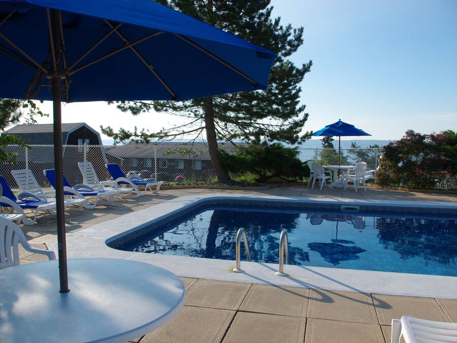 Seasonal outdoor pool, open 8:00 AM to 10:00 PM, pool umbrellas