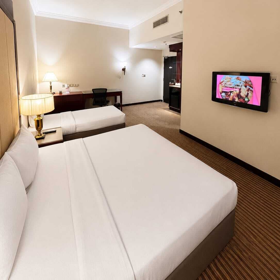 Deluxe Triple Room | In-room safe, individually furnished, desk, iron/ironing board