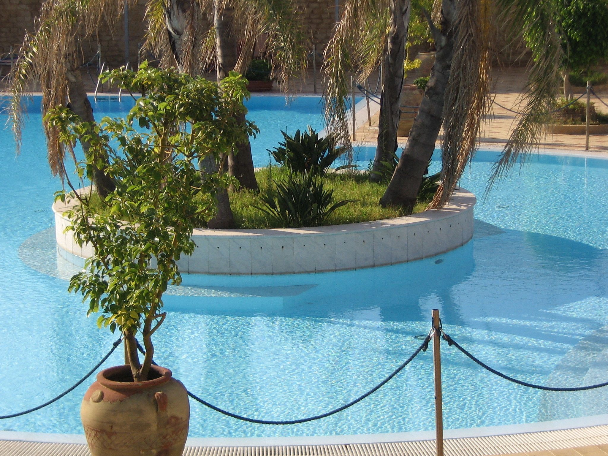 seasonal outdoor pool, open 8:00 am to 6:00 pm, pool umbrellas