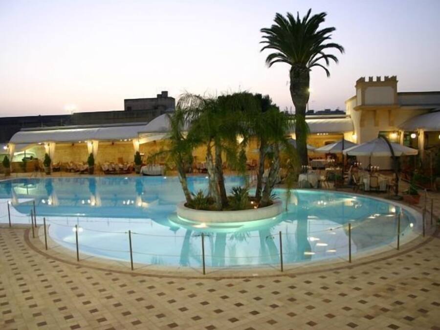 Seasonal outdoor pool, open 8:00 AM to 6:00 PM, pool umbrellas