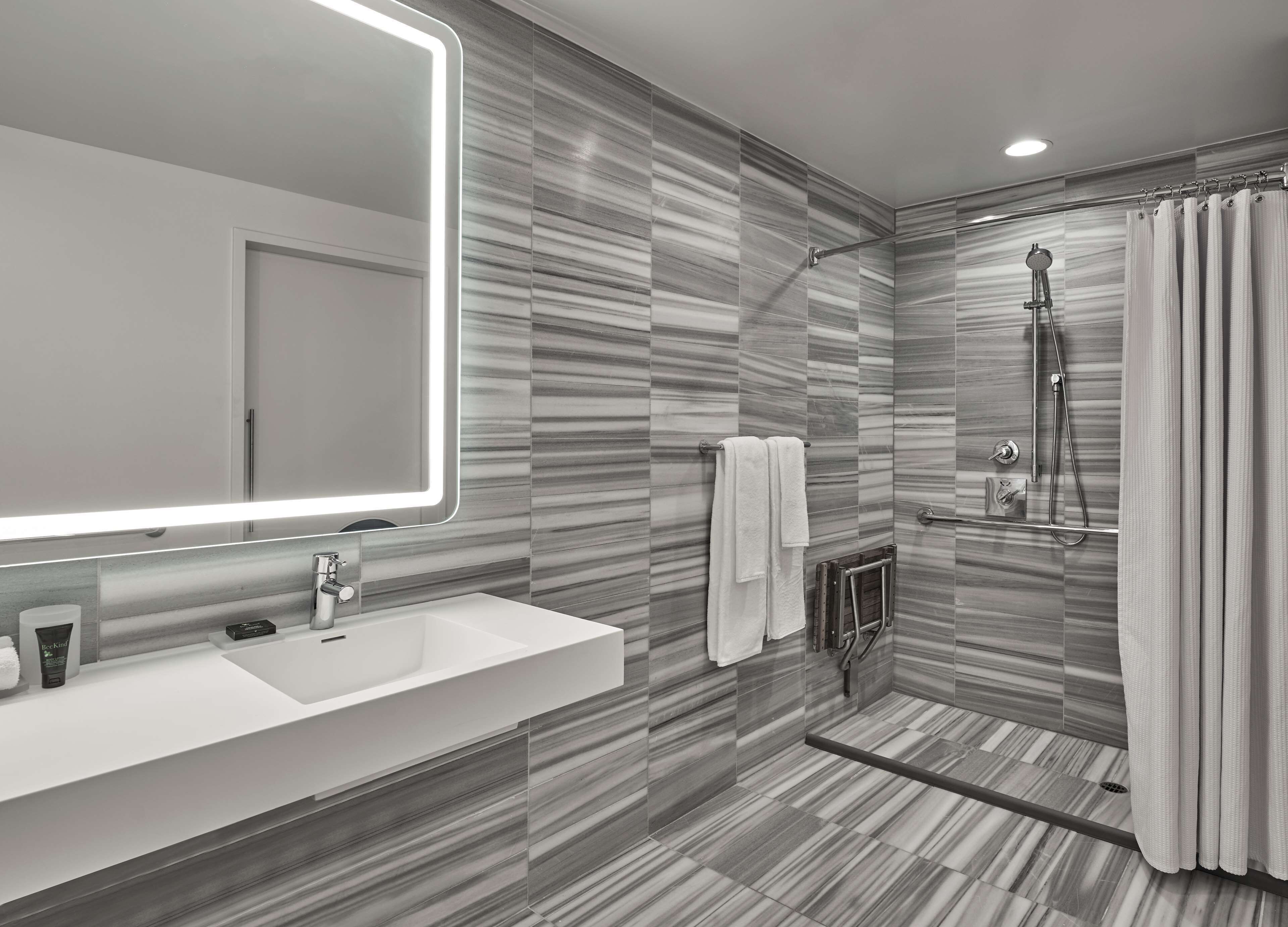 designer toiletries, hair dryer, bathrobes, towels