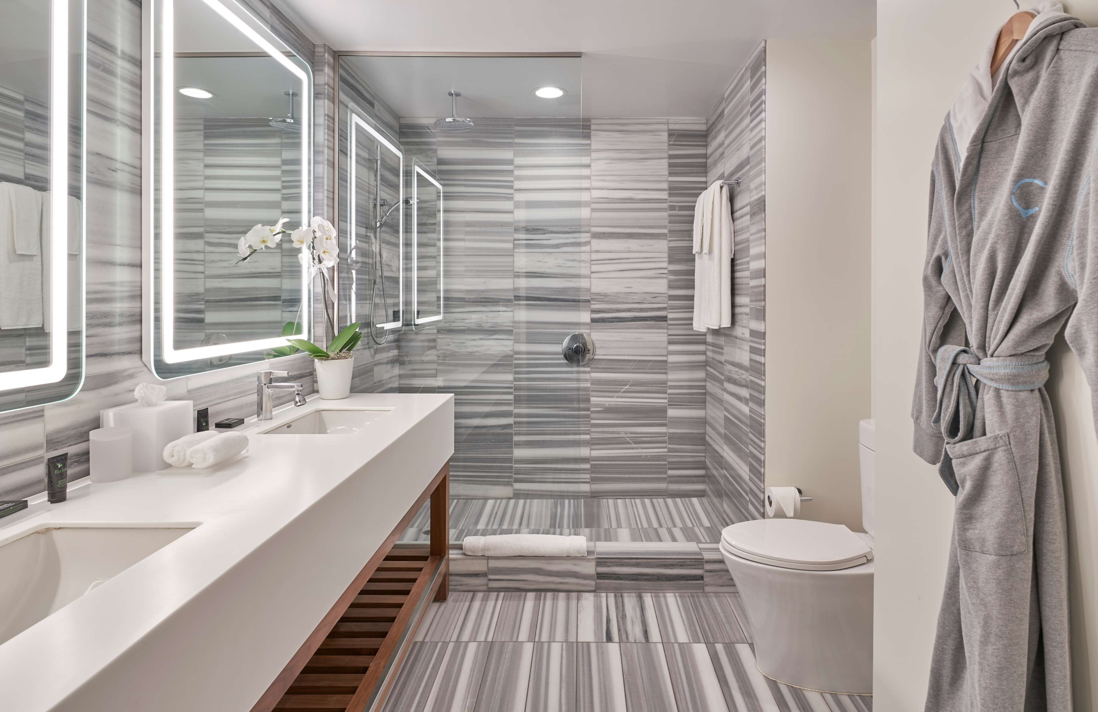 studio suite | bathroom | designer toiletries, hair dryer, bathrobes, towels