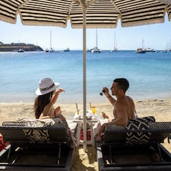 On the beach, sun loungers, beach umbrellas, beach towels