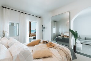 Luxe beddengoed, donsdekens, een minibar met enkele gratis items