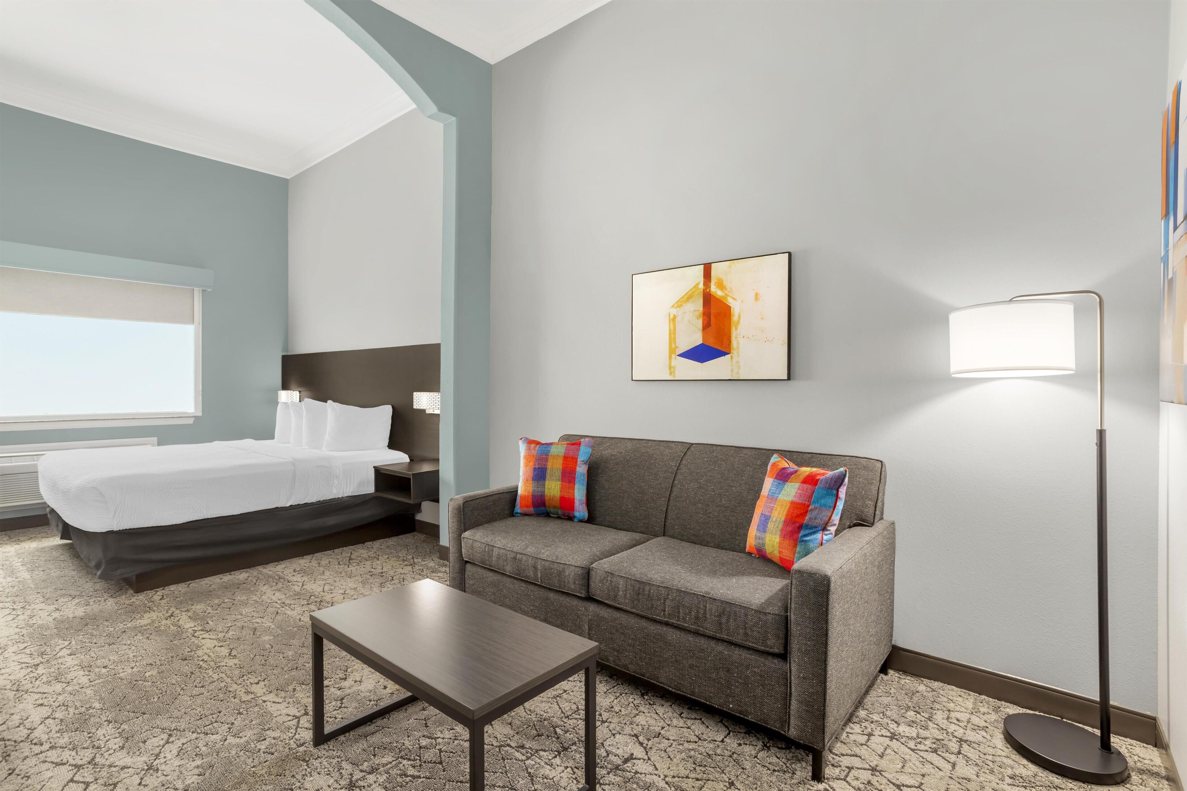 Suite, 1 King Bed, Non Smoking | Pillowtop beds, in-room safe, individually decorated, desk