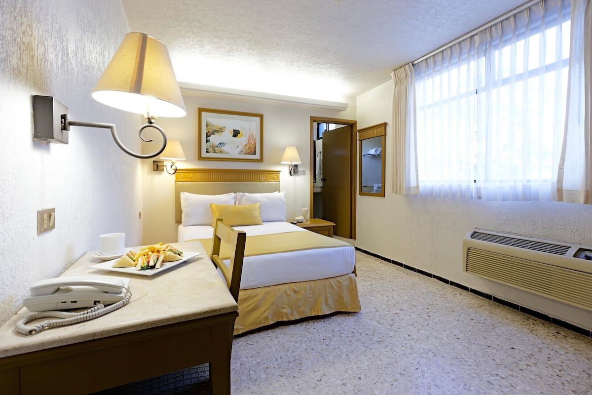 In-room safe, desk, blackout curtains, iron/ironing board (on request)