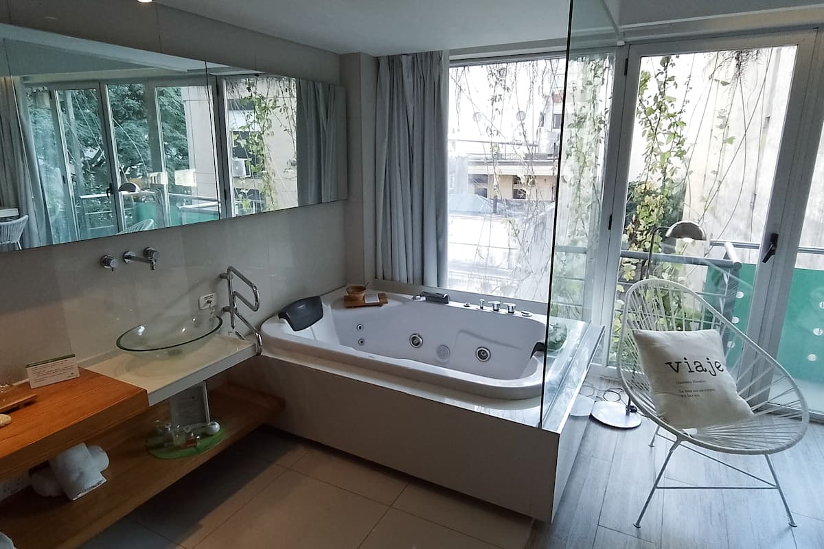 deluxe double room | bathroom | separate bathtub and shower, jetted bath, hydromassage showerhead