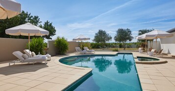 Outdoor pool, pool umbrellas, sun loungers