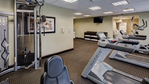 A gym with treadmills, a weight machine, and a mirror. - Holiday Inn Express Columbus-Dublin by IHG (Dublin)