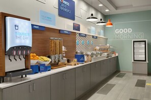 A breakfast bar with labeled sections for fruit, cereal, hot food, and bakery. - Holiday Inn Express Hotel & Suites Norfolk Airport by IHG (Norfolk)