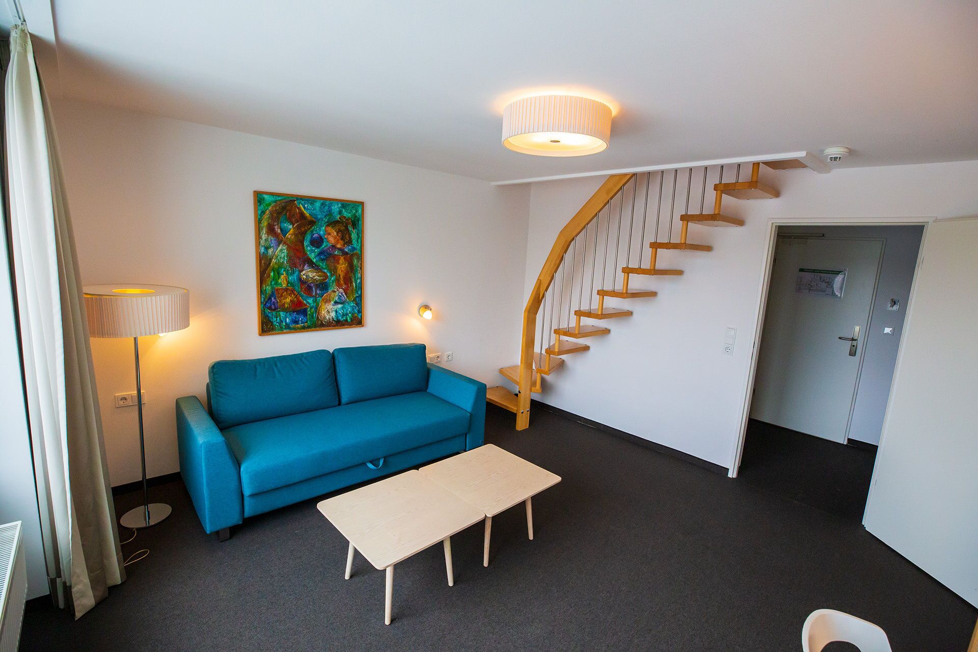 junior suite | living area | flat-screen tv