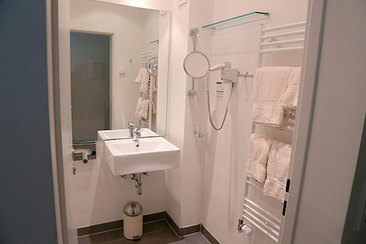 separate bathtub and shower, free toiletries, hair dryer, bathrobes