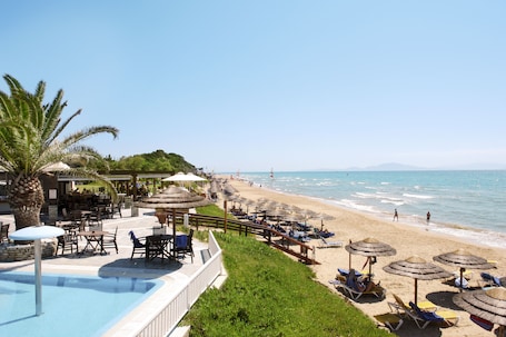 On the beach, sun loungers, beach umbrellas, beach towels