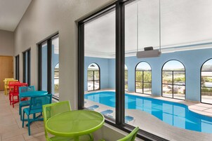 Indoor pool, open 10:00 AM to 10:00 PM, pool loungers