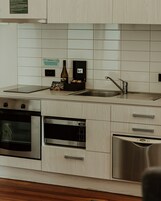 One Bedroom Apartment | Private kitchen | Fridge, microwave, stovetop, dishwasher