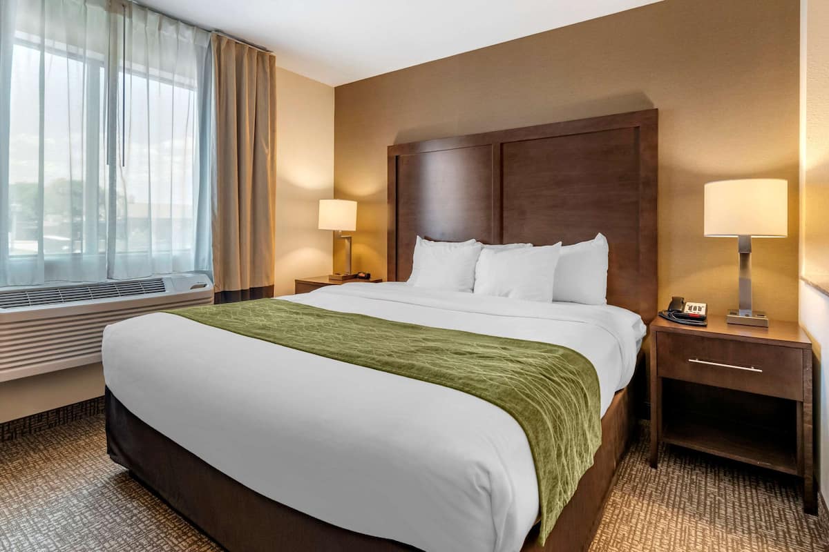 Premium bedding, blackout curtains, iron/ironing board