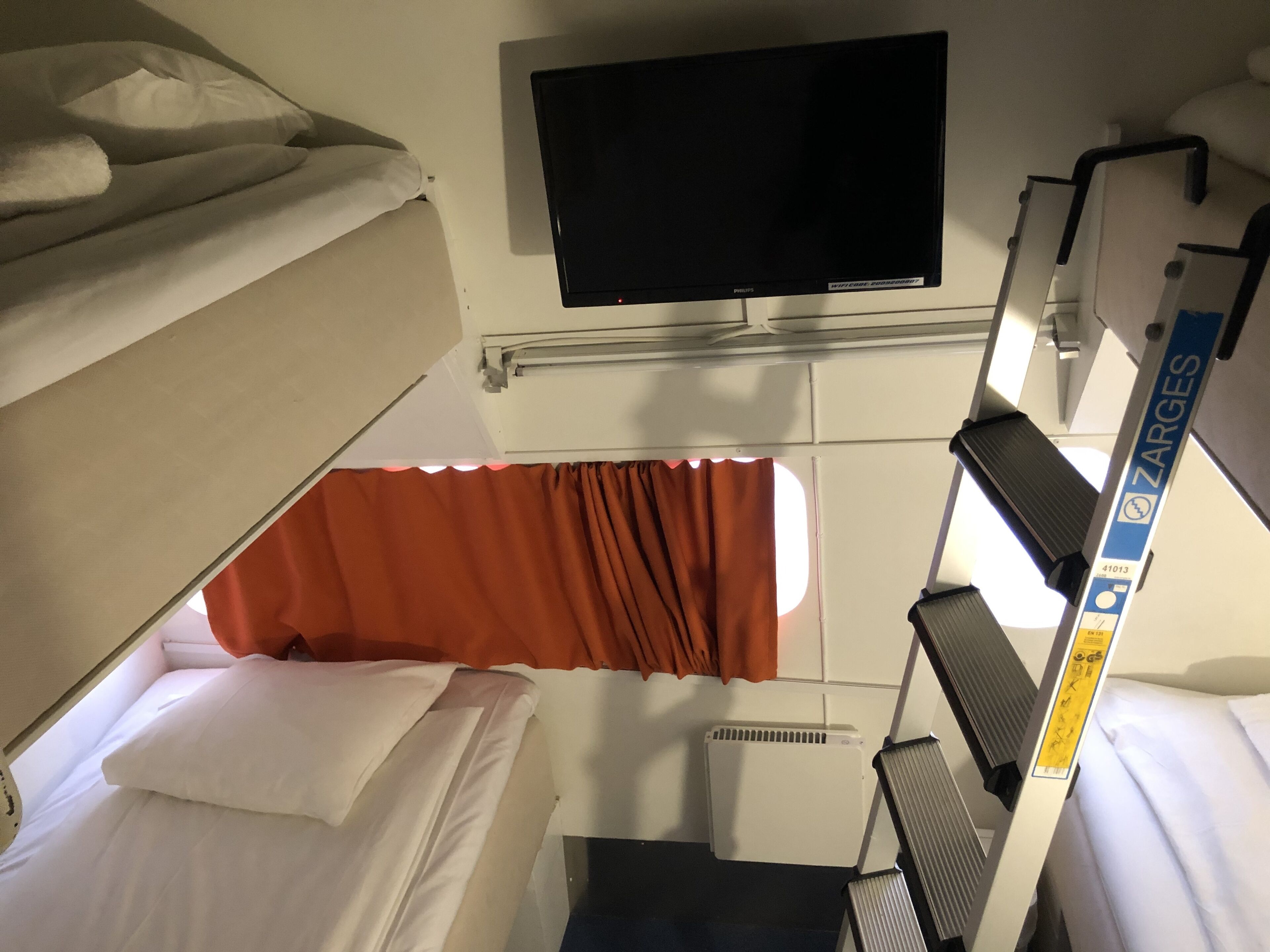 premium bedding, pillow-top beds, blackout curtains, soundproofing