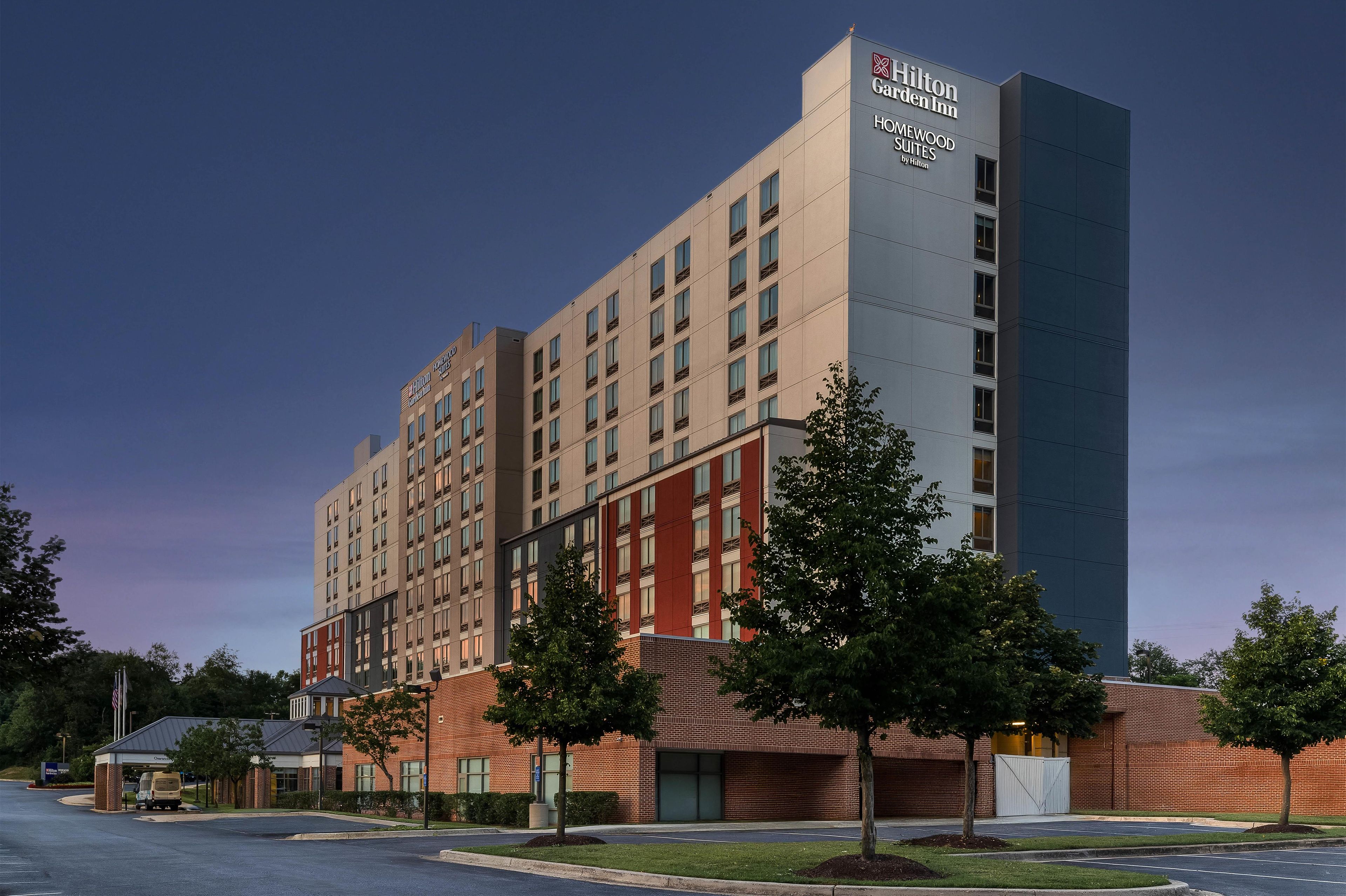 A multi-story hotel with a prominent sign for Hilton Garden Inn.
