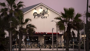 A building with a sign that reads "Pacific City."