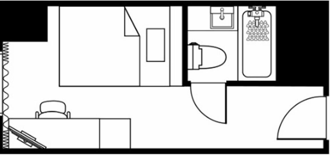 Een plattegrond met een badkamer, kitchenette en zithoek.