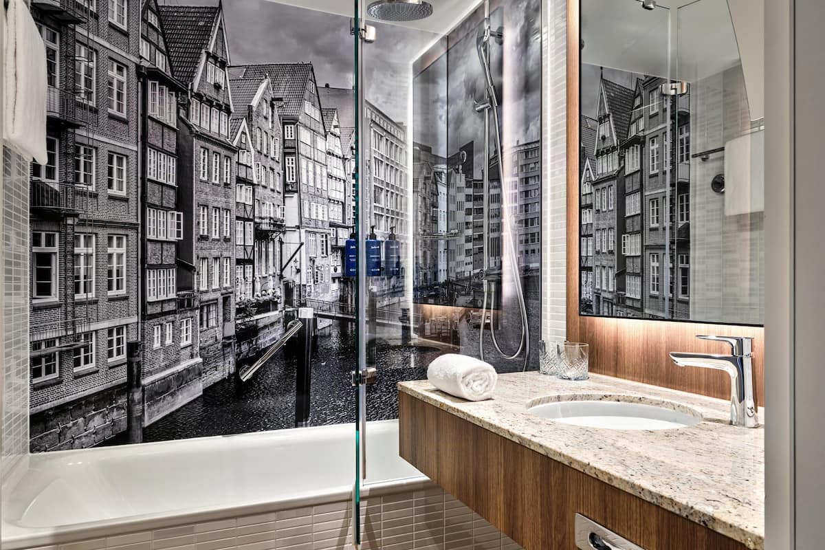 superior room | bathroom | shower, deep-soaking bathtub, free toiletries, hair dryer