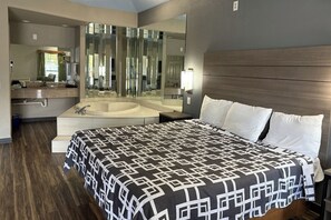 Suite, 1 King Bed, Non Smoking (Jacuzzi Tub) | Desk, iron/ironing board, free WiFi, bed sheets - Regency Inn & Suites By Capital O Houston IAH Airport (Humble)