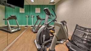 A fitness center with treadmills, an elliptical, and a bench. - Holiday Inn Express Hotel & Suites Minden by IHG (Minden)