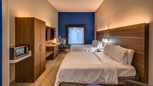A hotel room with two beds, a desk, a chair, a TV, and a window. - Holiday Inn Express Hotel & Suites Minden by IHG (Minden)