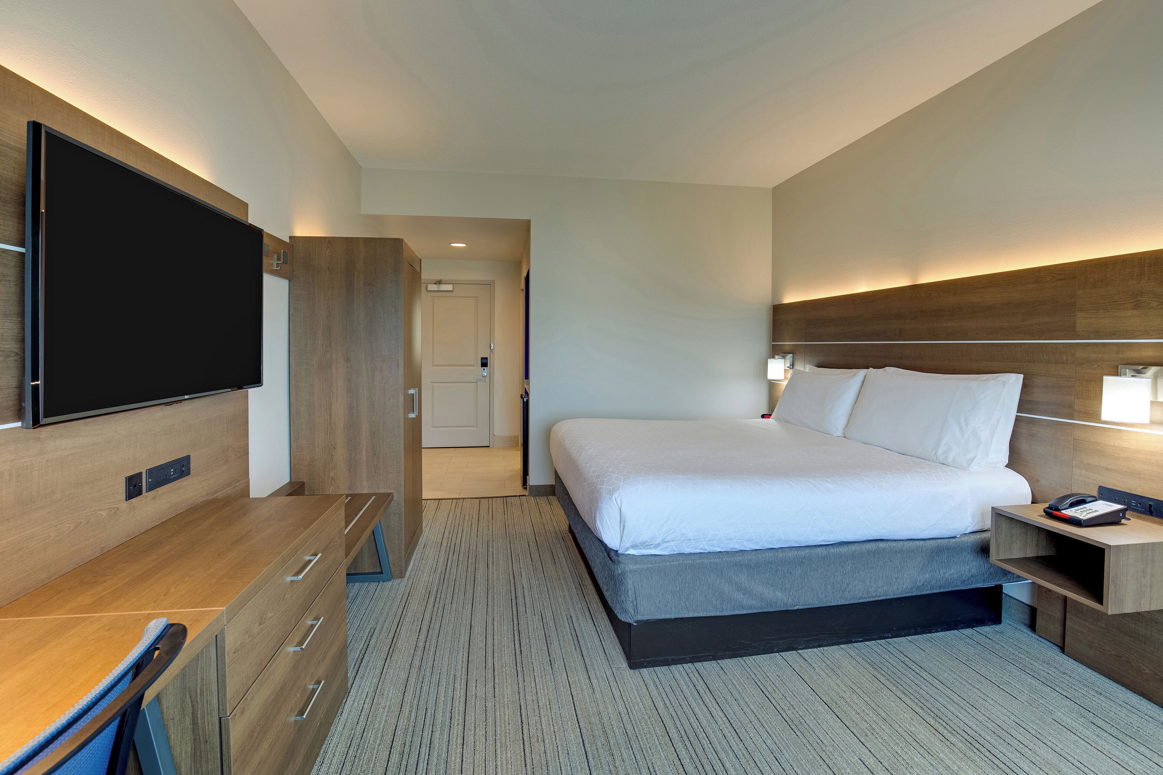 Premium bedding, desk, laptop workspace, blackout curtains