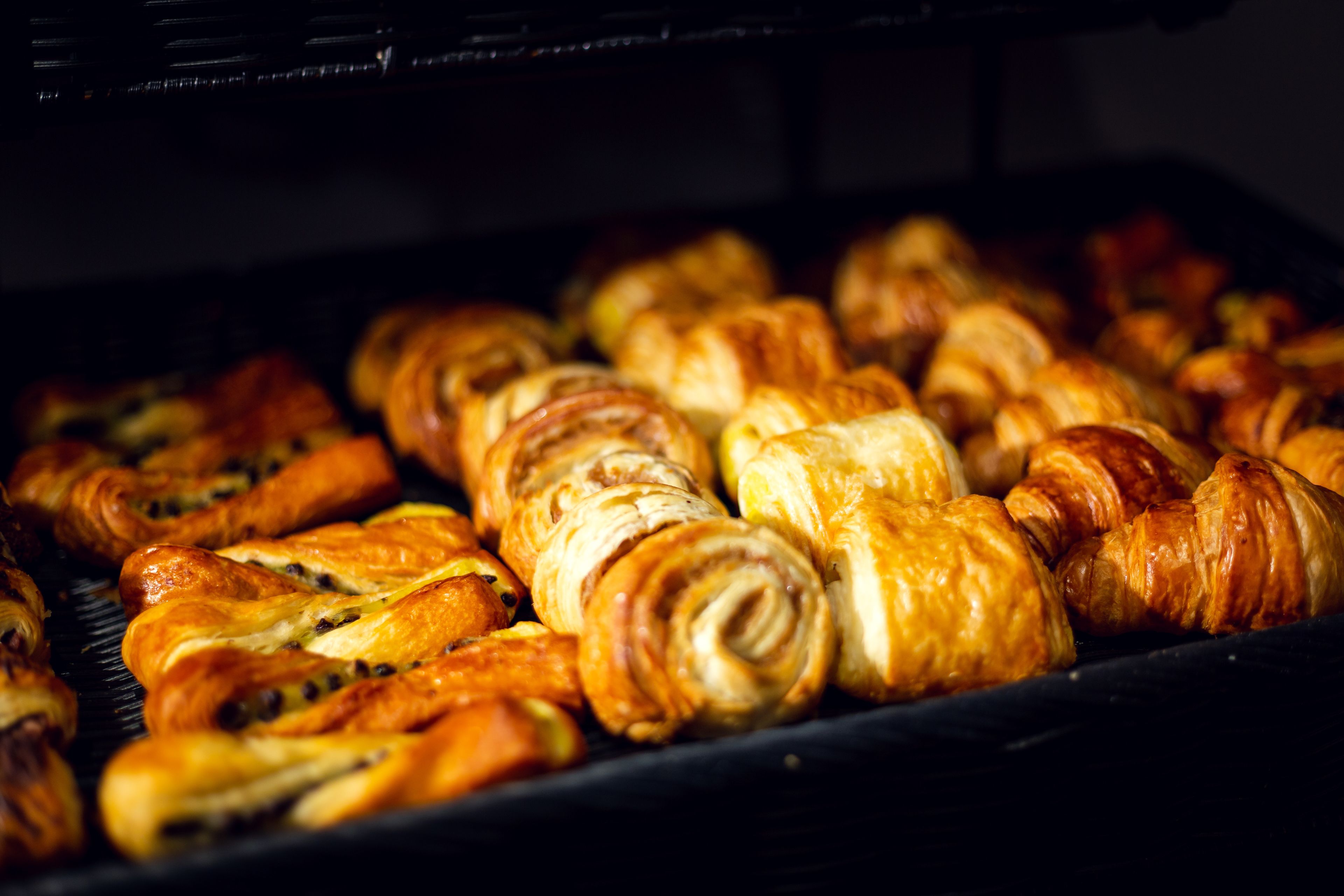 A tray of assorted pastries in an oven.