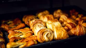 A tray of assorted pastries in an oven.