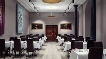 A conference room with tables set for a meeting.