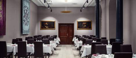 A conference room with tables set for a meeting.