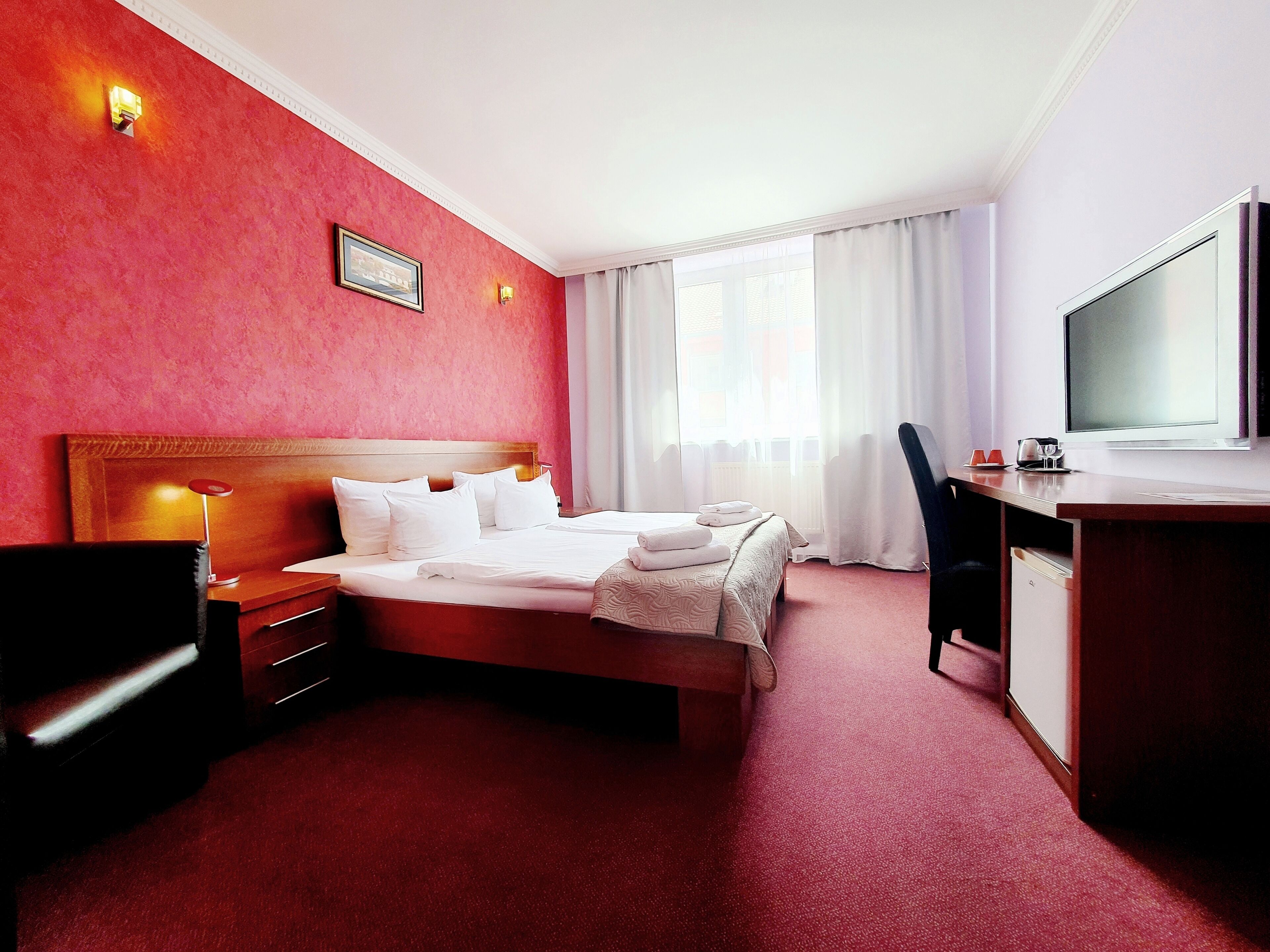 In-room safe, desk, blackout curtains, iron/ironing board (on request)