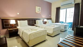 Standard Triple Room, 3 Bedrooms | Pillowtop beds, minibar, iron/ironing board, free WiFi