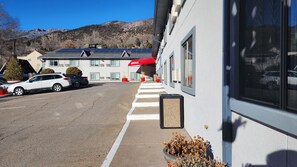 A building with a red awning labeled "OFFICE" and solar panels on the roof. - Adventure Inn - Glenwood Springs  (Glenwood Springs)