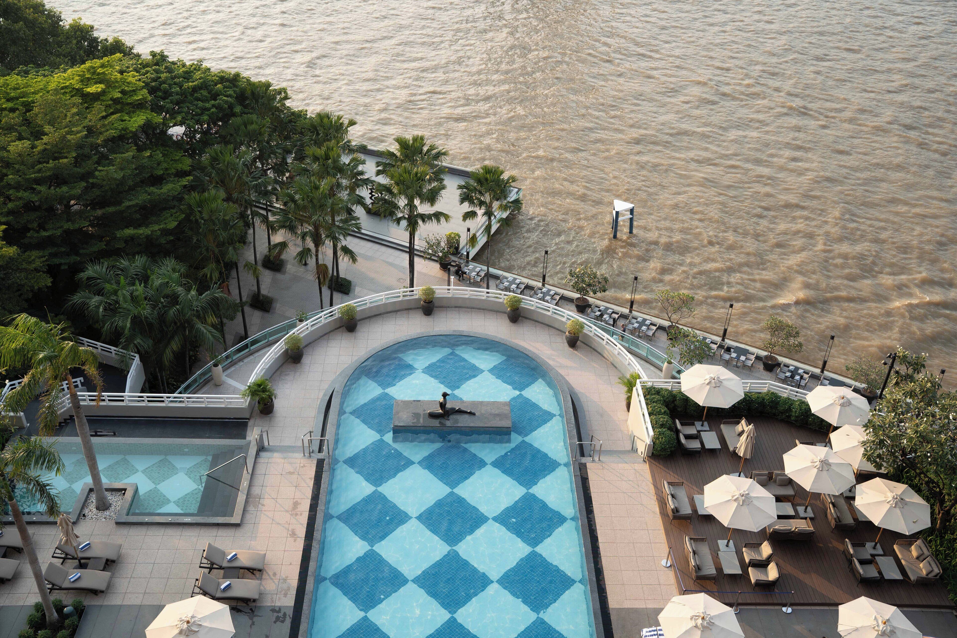 Outdoor pool, open 6:00 AM to 10:00 PM, pool umbrellas, pool loungers