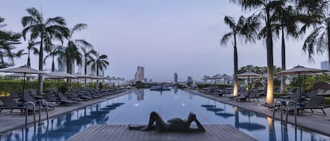 Outdoor pool, open 6:00 AM to 10:00 PM, pool umbrellas, pool loungers