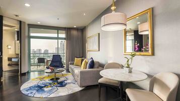 One Bedroom Skyline Suite King Bed | Living area | 55-inch LED TV with digital channels, TV