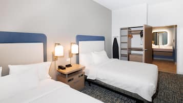 Hypo-allergenic bedding, in-room safe, laptop workspace