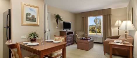 Suite, 1 King Bed | Living area | 32-inch LCD TV with cable channels, TV