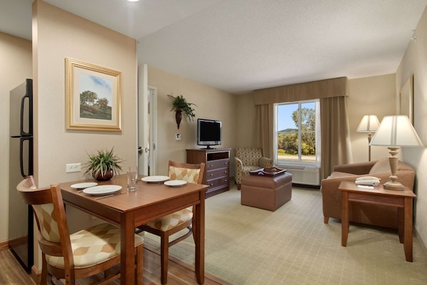 Suite, 1 King Bed | Living area | 32-inch LCD TV with cable channels, TV