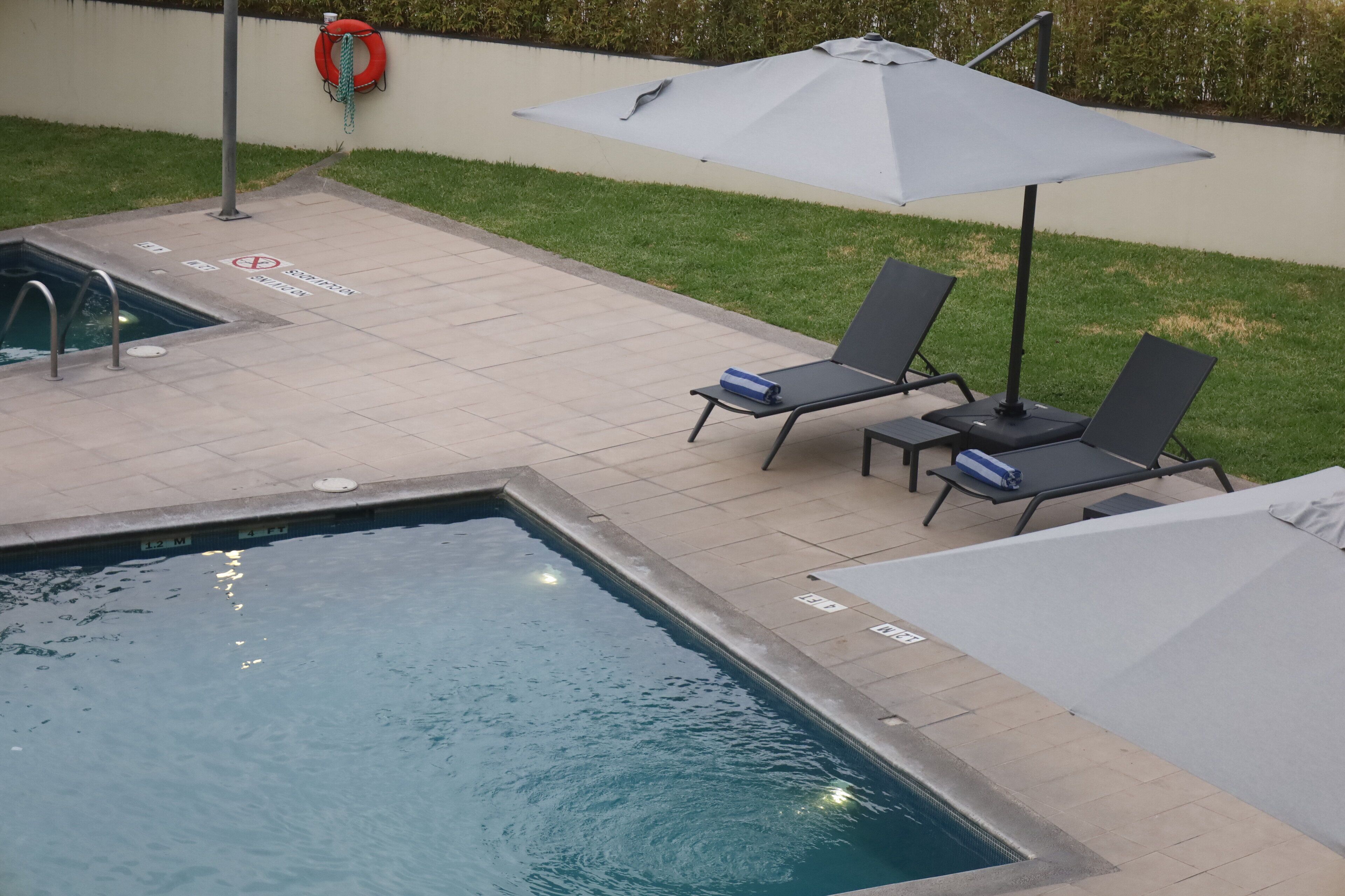 outdoor pool, open 8 am to 9 pm, pool loungers